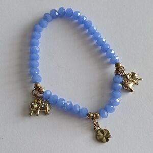 Elephant bracelet blue beads stretch gold tone shamrock 4 leaf clover